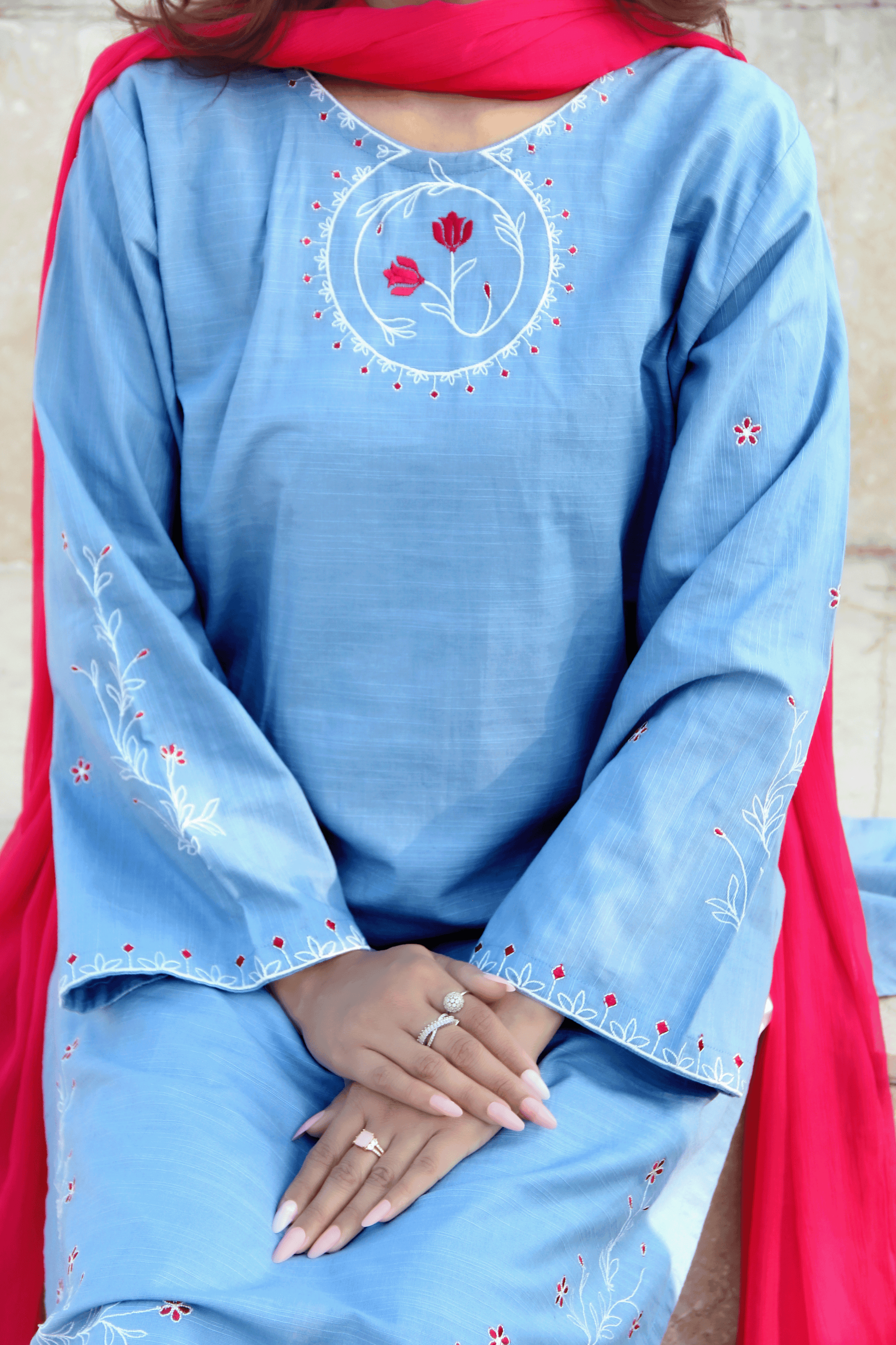 Light blue embroidered kurta with a red dupatta
